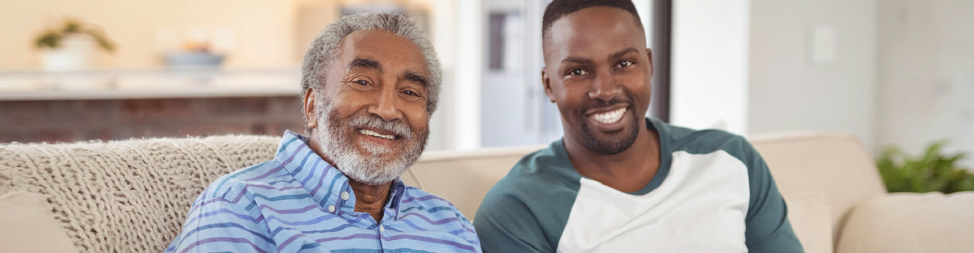 a father and son smiling at the camera